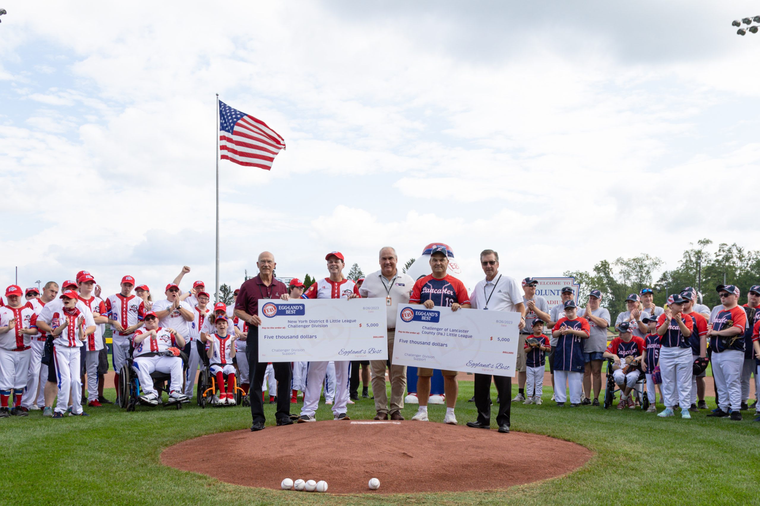 Eggland's Best Check presentation at 2023 LLWS Challenger Exhibition Game